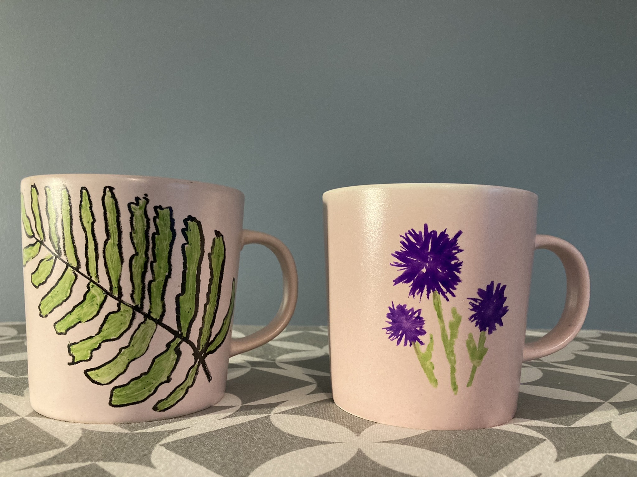 Set of pink mugs with a hand-painted plant motif